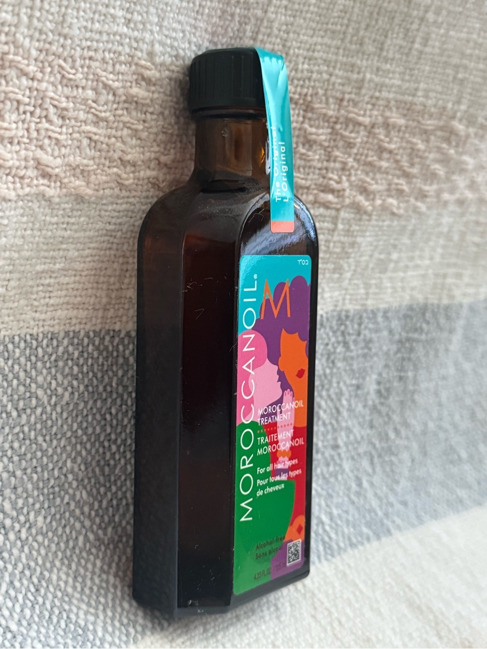 Moroccanoil Treatment Bottle with Teal and Purple Label - Picture 3 of 3